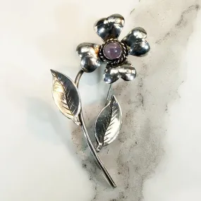 Playful Silver Flower Brooch with Amethyst Pistil