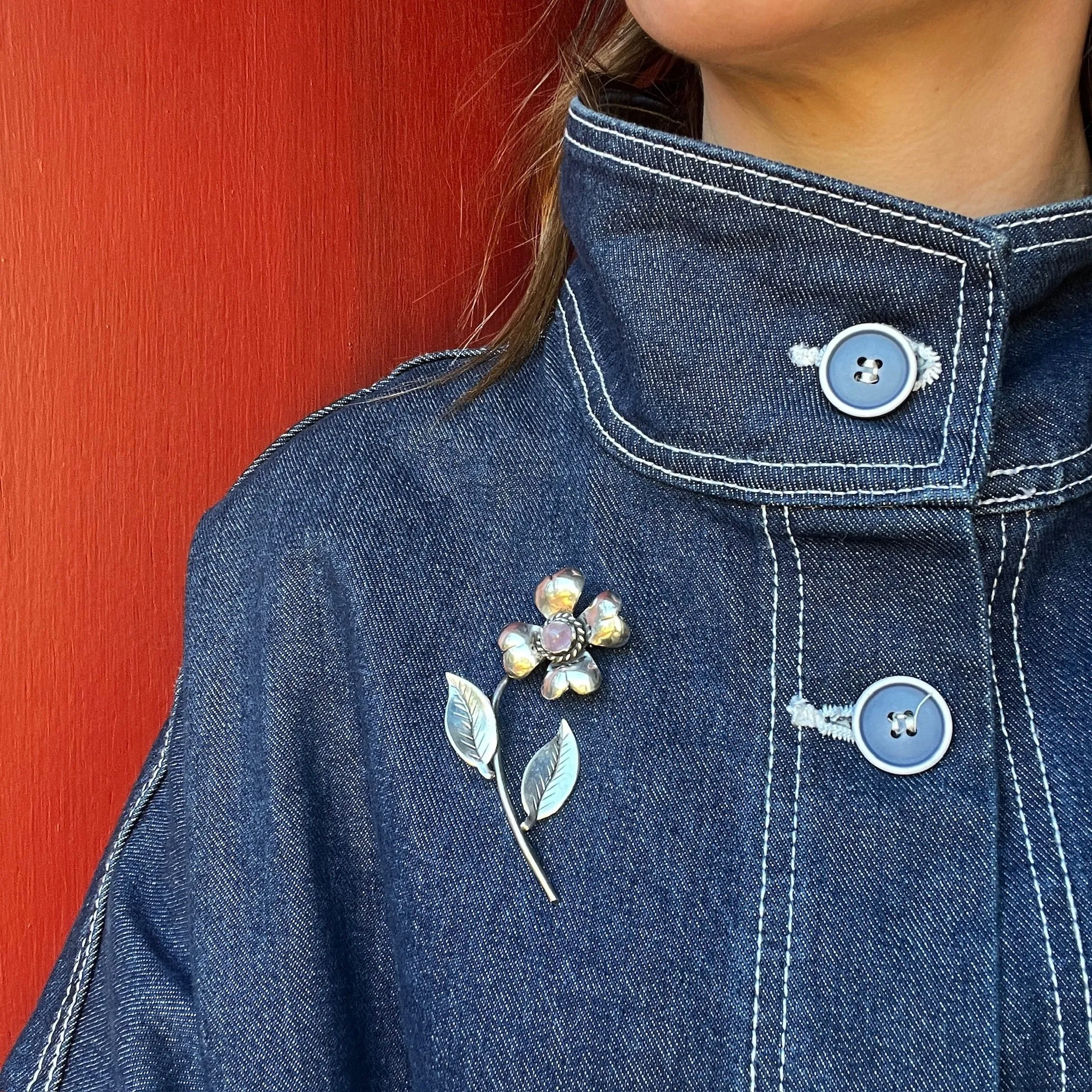 Playful Silver Flower Brooch with Amethyst Pistil