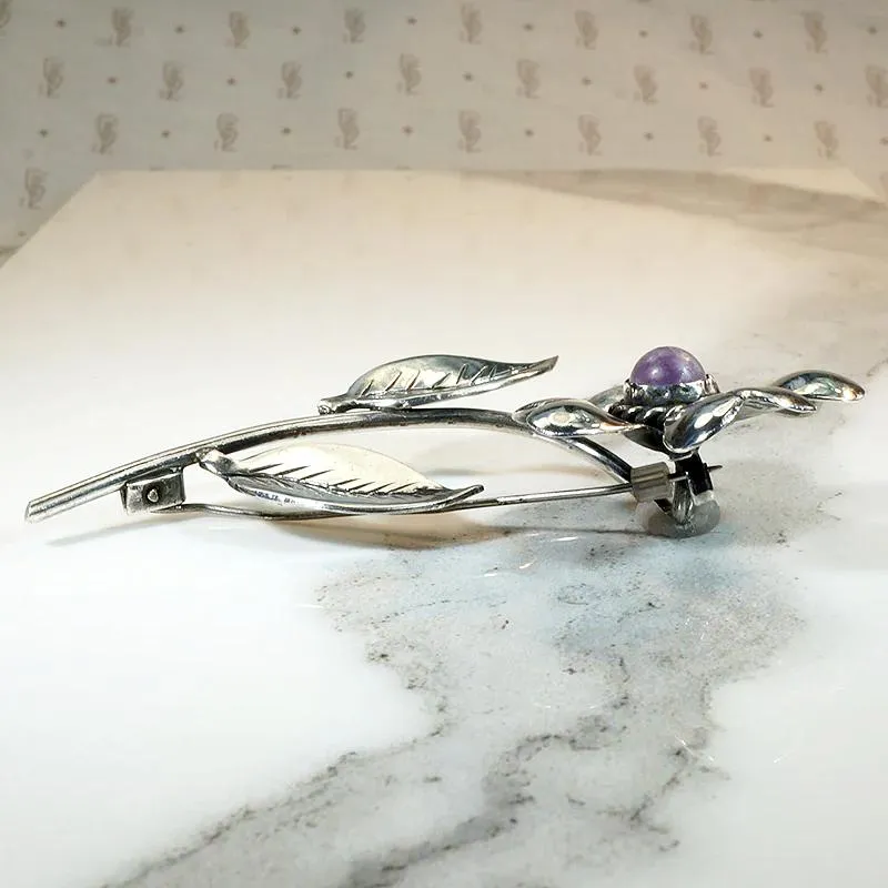 Playful Silver Flower Brooch with Amethyst Pistil